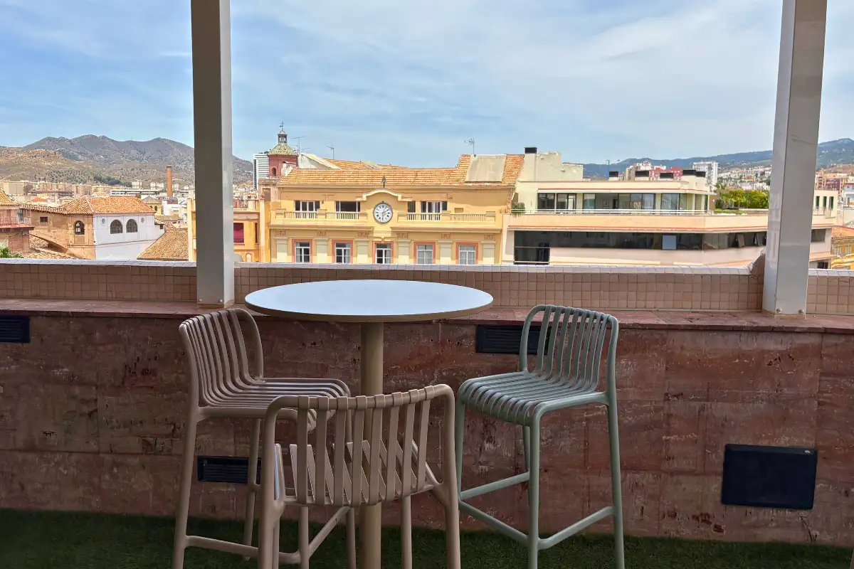 Terrace table with rooftop and mountain views at La Terraza de Larios in Malaga