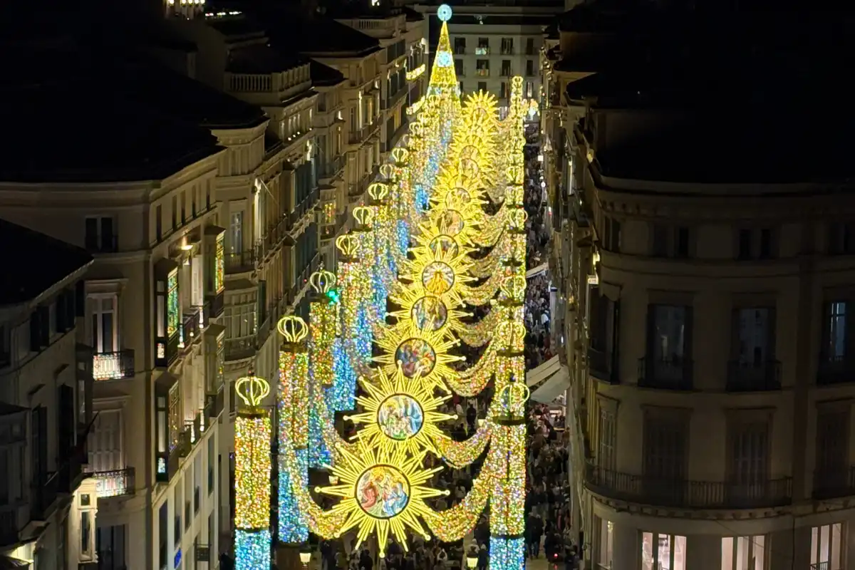 Málaga Christmas lights viewed from a rooftop bar with Calle Larios illuminated below