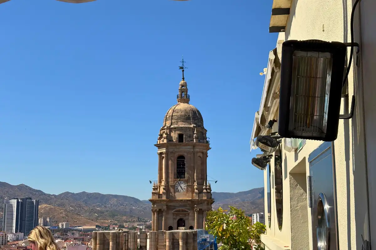 Malaga Cathedral tower framed by city streets from AC Hotel Malaga Palacio rooftop