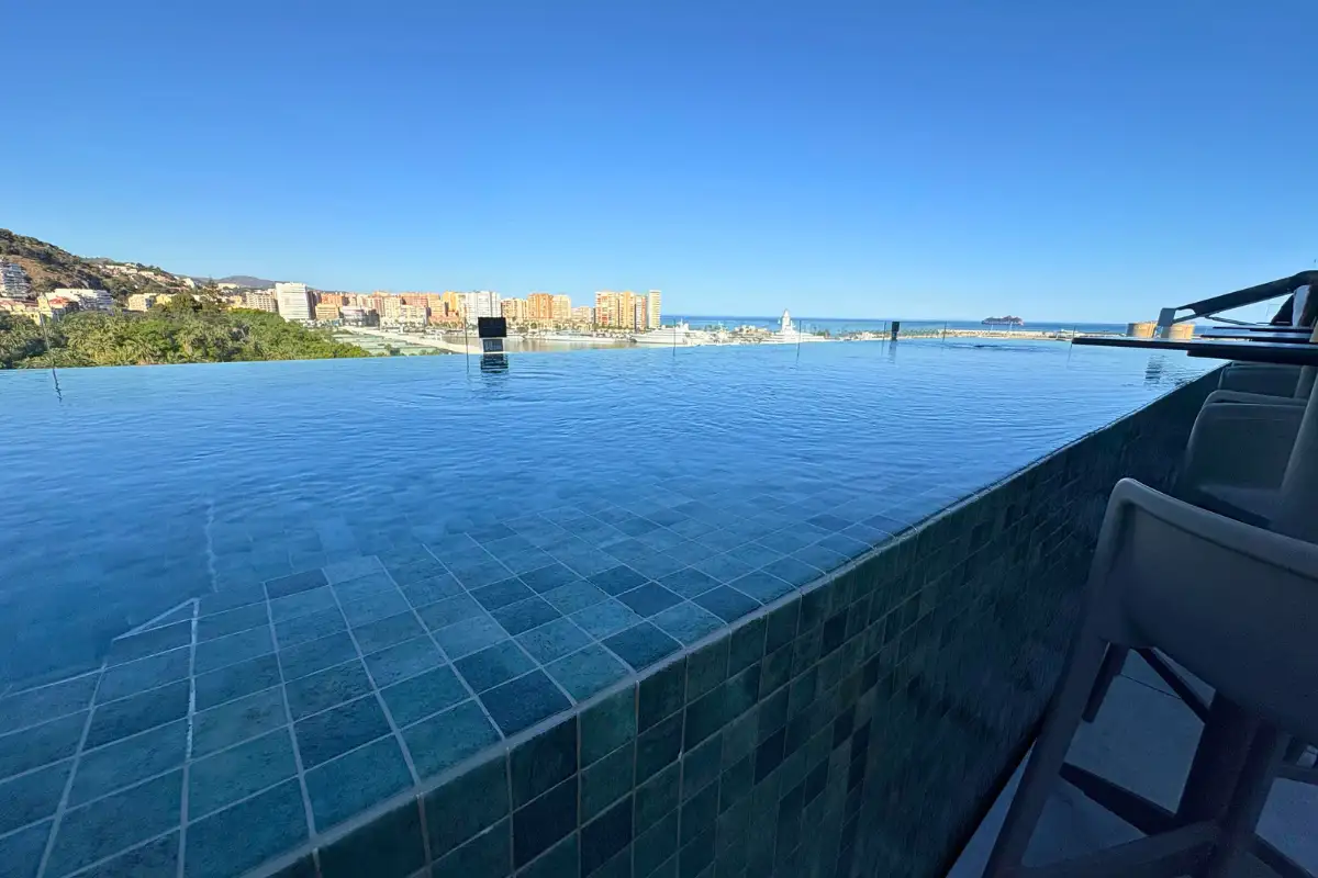 Infinity pool edge overlooking the city and port at Lolita Skyview in Malaga